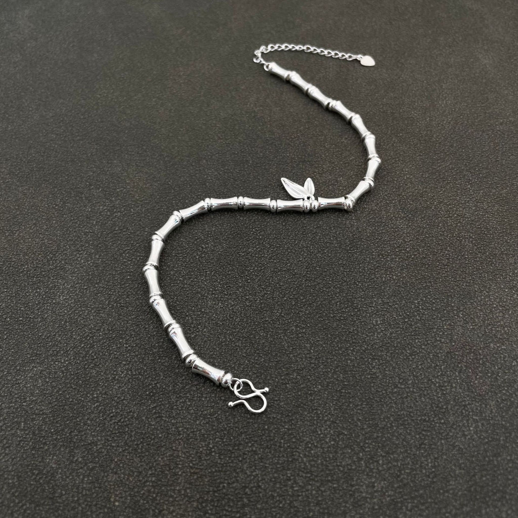 Traditional silver-plated bamboo bracelet with bamboo motifs, symbolizing peace and prosperity, and a string of bamboo leaves representing continuous advancement – a niche women's bracelet.