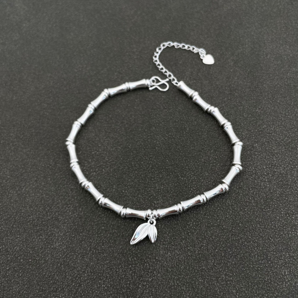 Traditional silver-plated bamboo bracelet with bamboo motifs, symbolizing peace and prosperity, and a string of bamboo leaves representing continuous advancement – a niche women's bracelet.